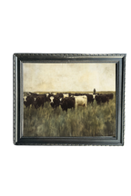 Grazing Cows artwork by Luxe B Co Canada showing black and white cattle in a grassy field within a dark decorative frame.