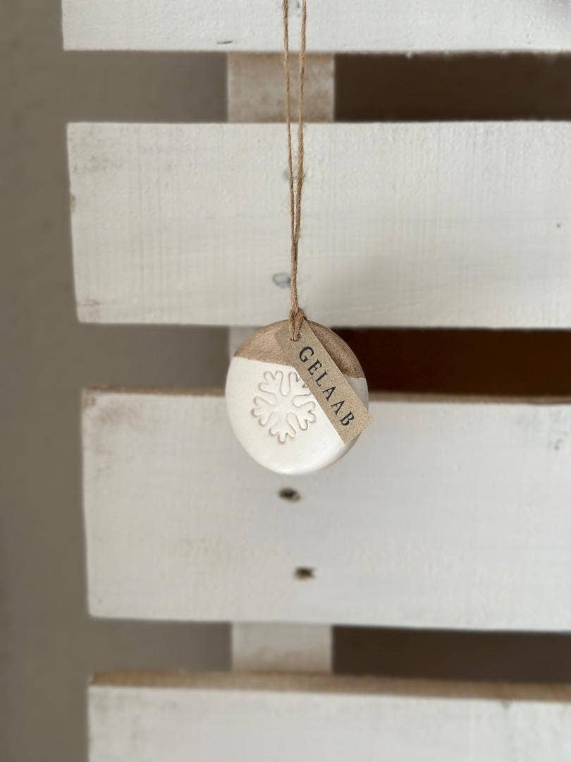Handmade Ceramic Circle Ornament with Snowflake Carving