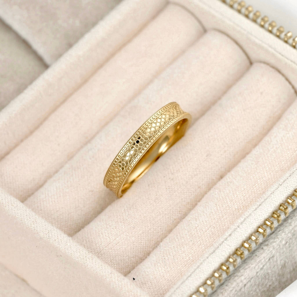 Blueyejewelry gold stacking ring with textured detailing and polished edges in a cream jewellery case.