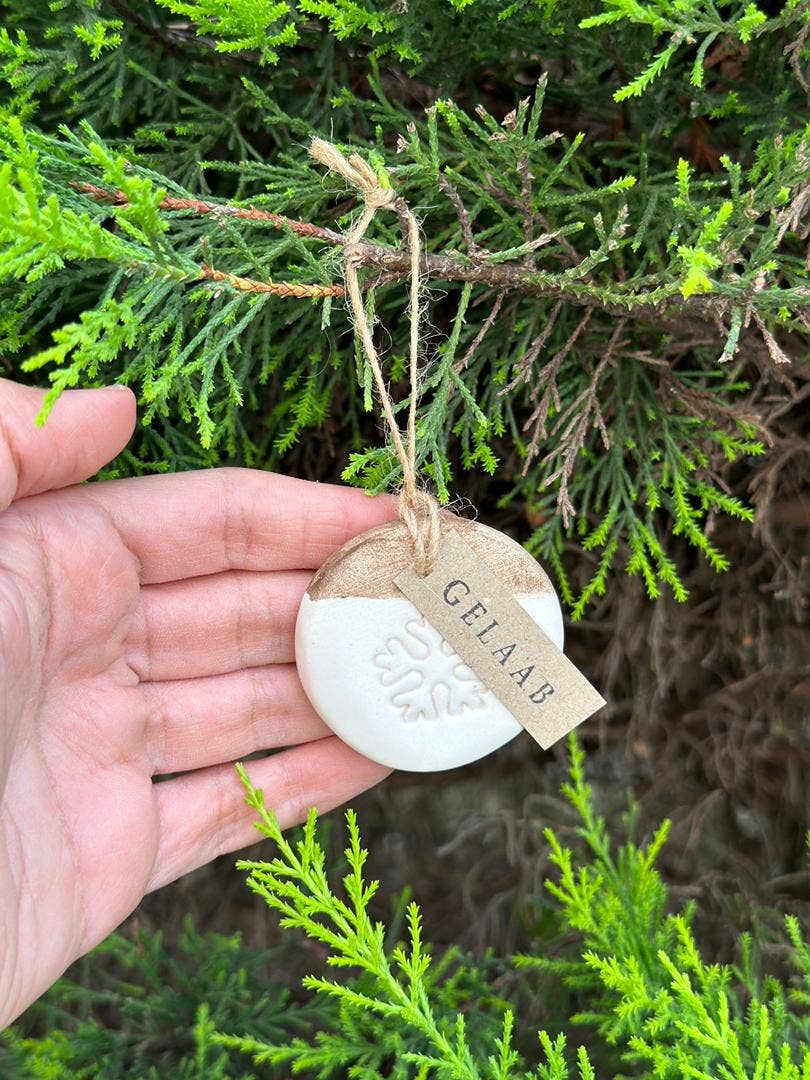 Handmade Ceramic Circle Ornament with Snowflake Carving