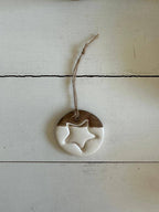 Handmade Ceramic Circle Ornament with Star Carving